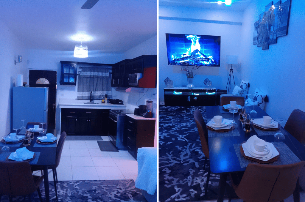 Kitchen and dining space at Serenity Dream showcasing blue ambient lighting, modern appliances, and stylish interior design