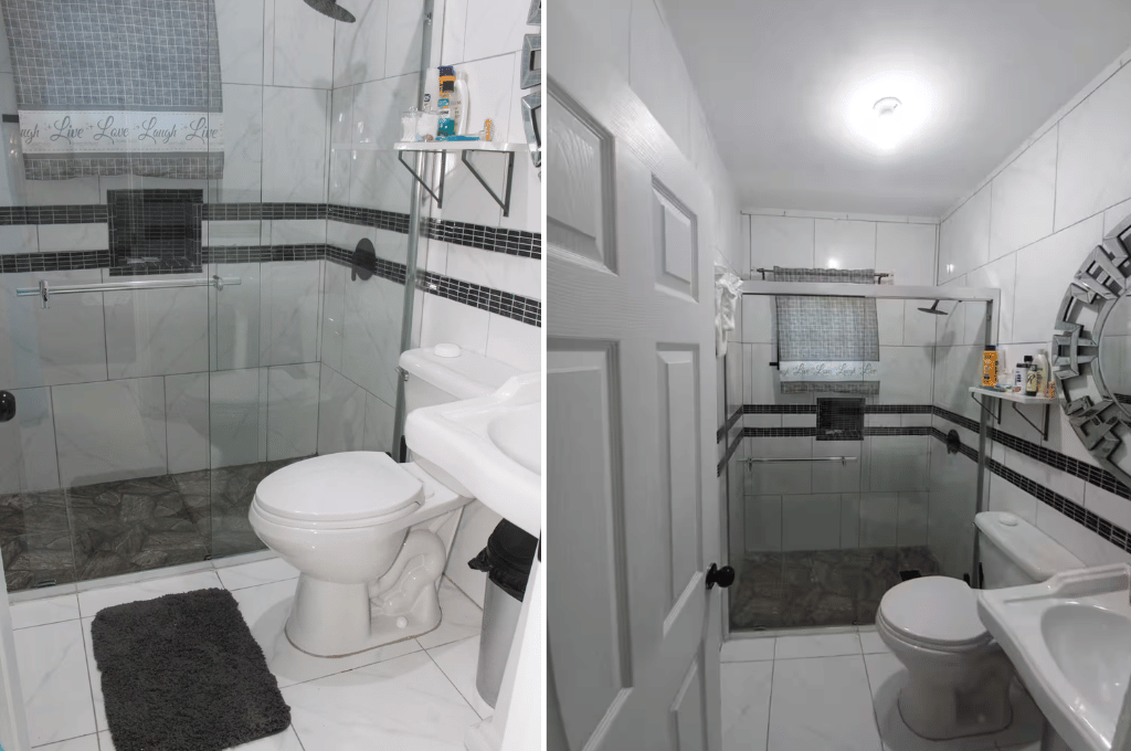 Serenity Vibes apartment bathroom featuring a walk-in glass shower, vanity, and modern tile design