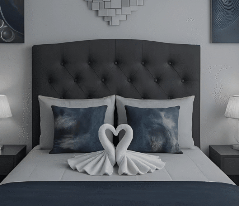 Beautiful Serenity View bedroom featuring swan towel décor on a modern tufted bed